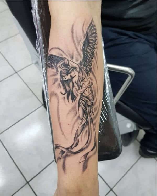 ALIVE Tattoos  Piercing   Angel abstract design with earth symbol on  inner forearm Inked by kishankanth Dm or Whatsapp for appointments  7277663322 7277663344 angel angeltattoo abstractangel  abstractangeltattoo angeldesign angeltattoos 